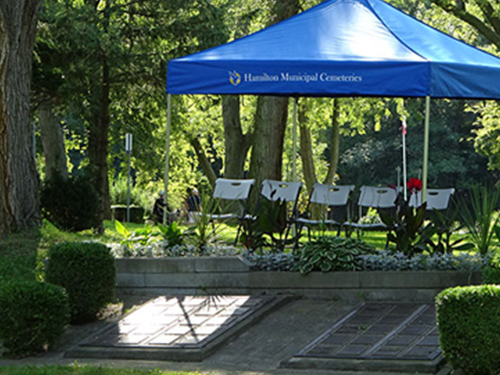 Blue tent with chairs cremorial