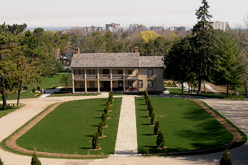 Lawn and trees in front of a historic building