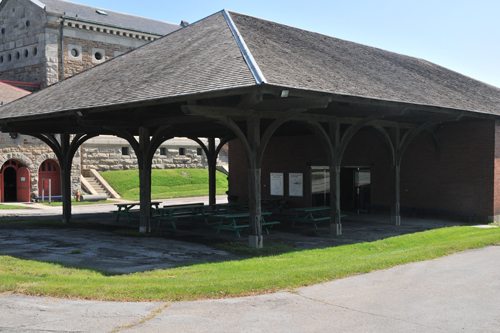 Open patio with a peaked roof and pillars