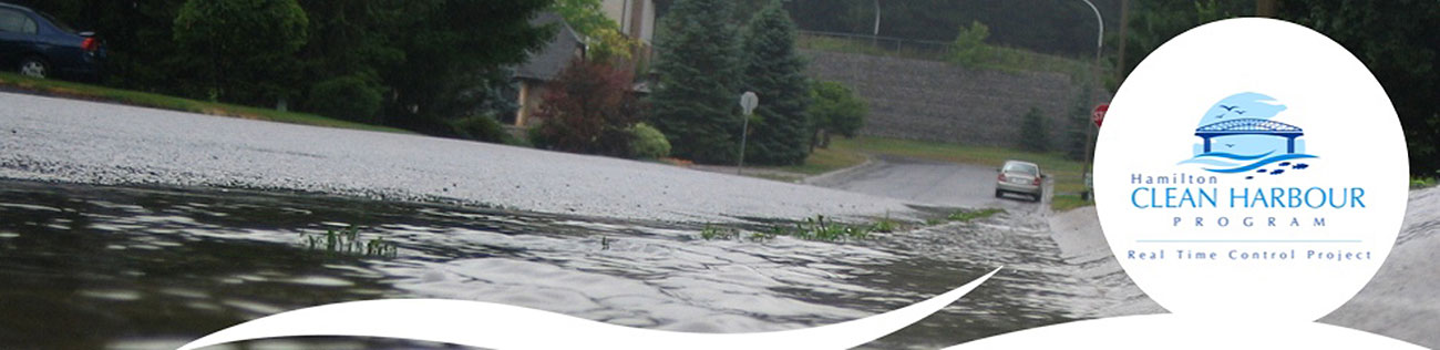 Water running downhill and on a roadway and curb