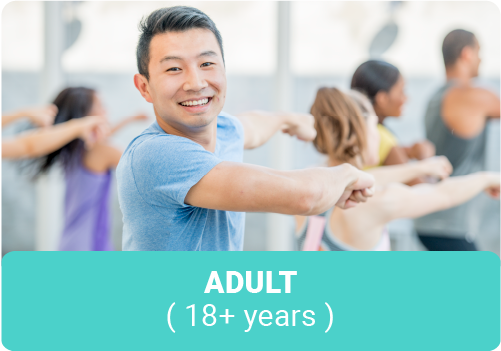 Focus on a young Asian man in a group exercise class