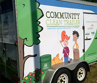 Side view of Community Clean Trailer - graphic wrapped vehicle