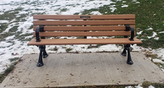 Park bench on concrete pad