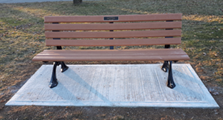 Park bench on concrete pad