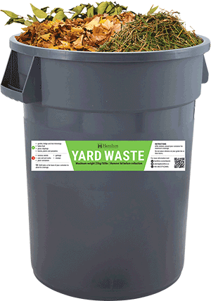 Yard waste container with new rectangular sticker on it