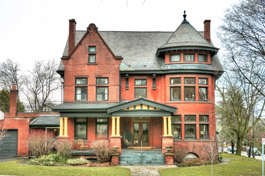 Three story renaissance house with front covered porch