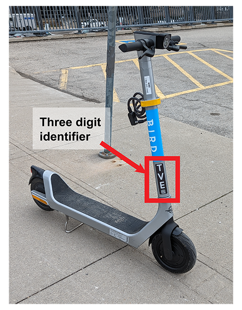 Location of three digit identifier on front shaft of e-scooter near wheel