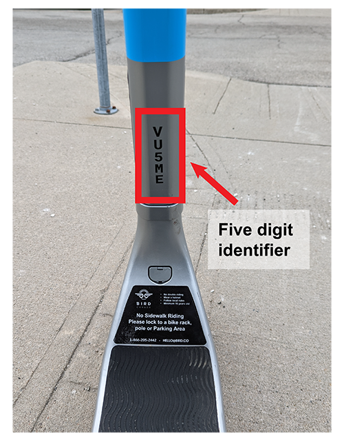 Location of five digit identifier on back of shaft of e-scooter near platform to stand