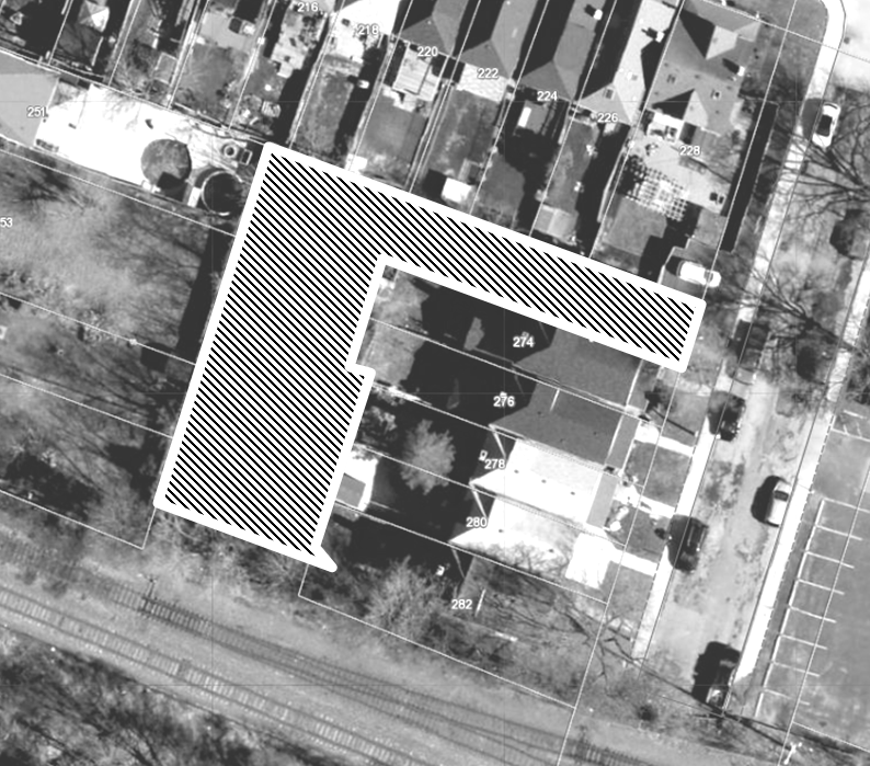 Aerial view if property parcel map with subject property identified in hatched outline
