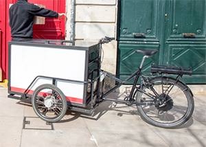 Reverse tricycle design with enclosed cargo box in the front. Photo Credit: Ontario.ca