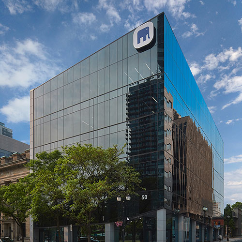 Effort Trust Office - transparent glass multi floor building at corner of King & Hughson