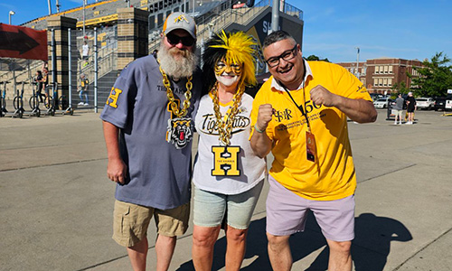 fans standing in front of stadium