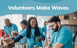 Group of volunteers packing cans in boxes