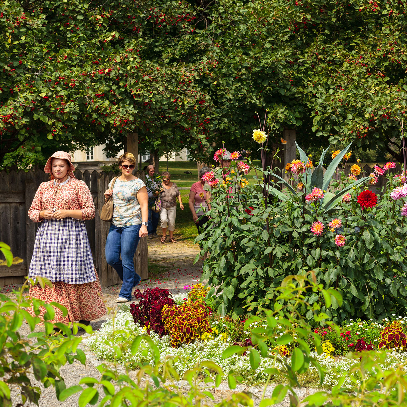Group of people being led on a tour of gardens at Dundurn National Historic Site