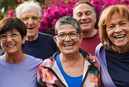 5 active looking seniors smiling at the camera