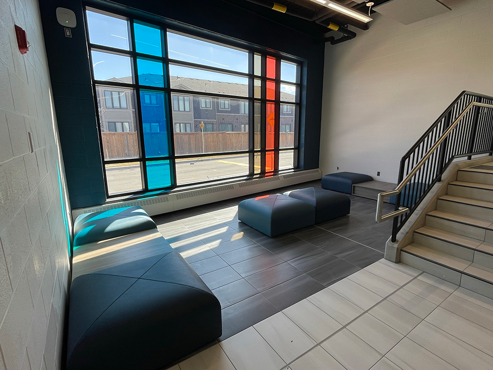 Interior revamped lounge with black ottomans in Sir Wilfrid Laurier Recreation Centre