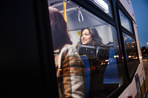 female passenger on a bus in the evening