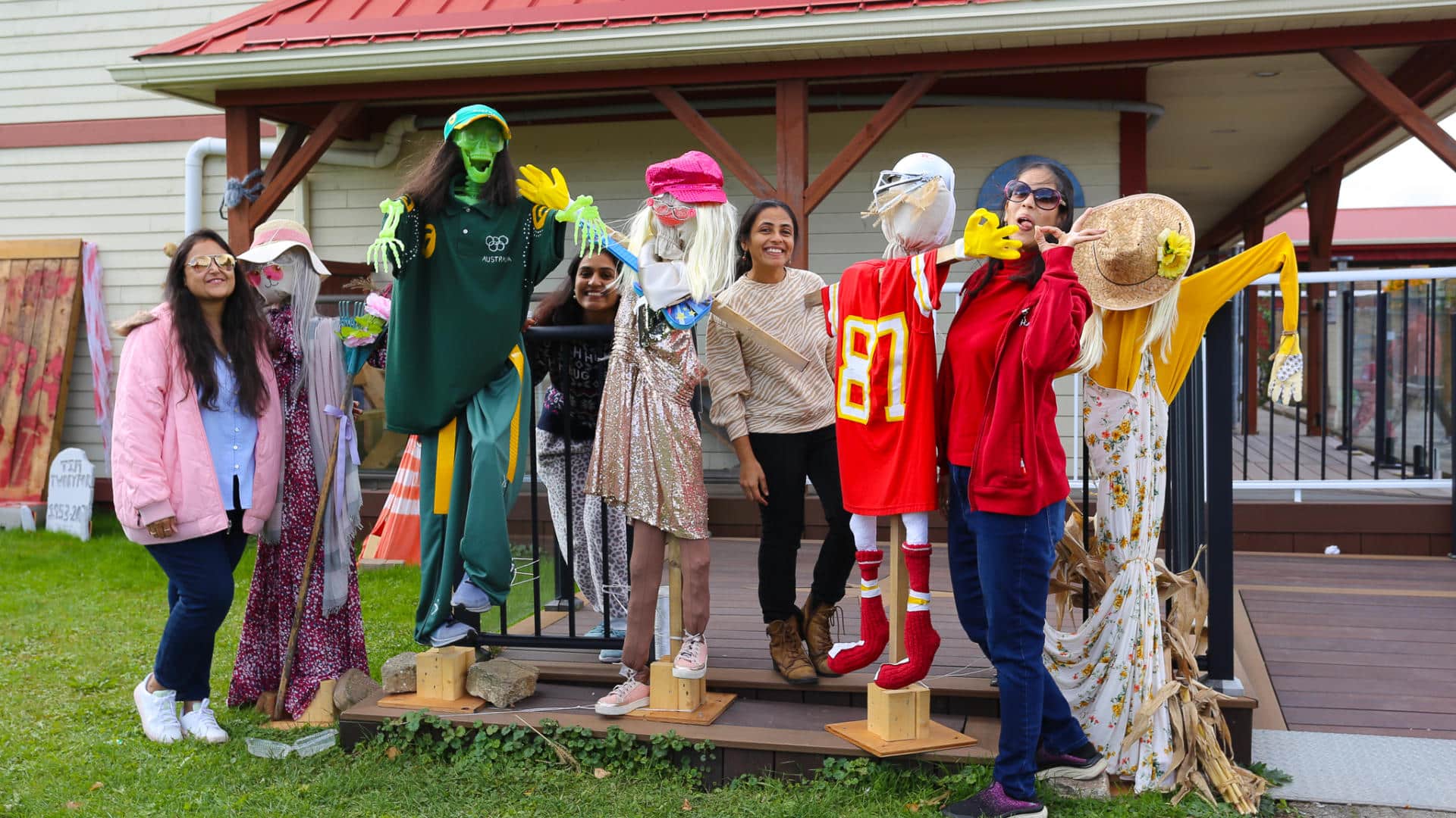 Halloween scarecrow display in front of a house