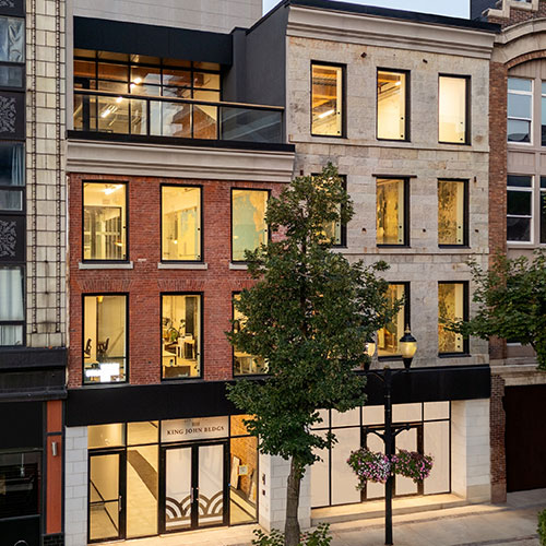 Renovated two long-vacant heritage buildings on Gore Park block prioritizing natural light and central atrium for plants.
