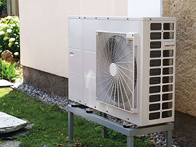 Heat Pump on stand beside house