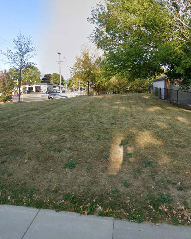 Grass covered empty lot for 64 East 31st Street