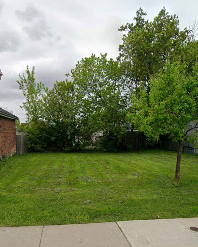 Empty grassed lot with trees for 79 Frederick Avenue, Hamilton