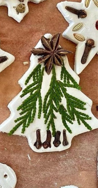 Saltdough Christmas tree shaped ornament decorated with cedar and dried star anise