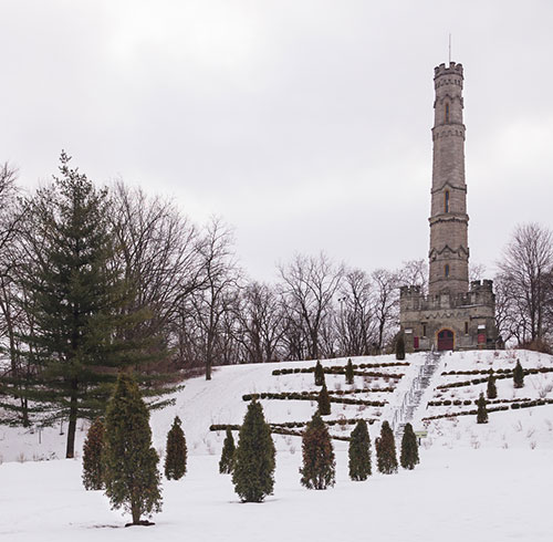 Exterior Battlefield Park looking towards the tower in winter. Snow on the ground.
