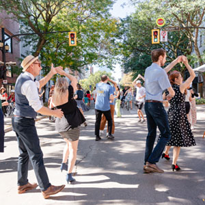 People swing dancing on King Street during September 2025's Open Streets