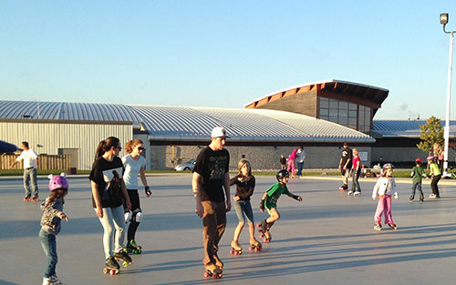 People roller skating at Pier 8 in summer time