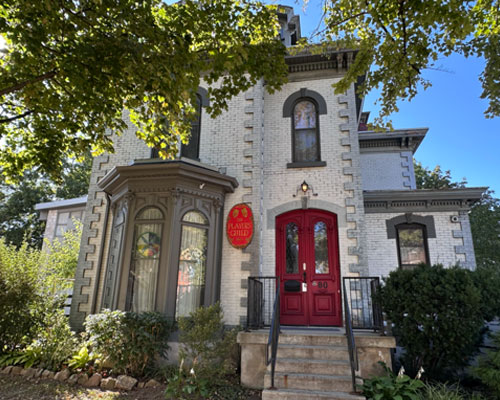 Italianate style white brick house with studio space