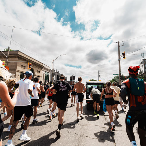 people running on King street east as part of Open Streets social run
