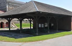 Open patio with a peaked roof and pillars