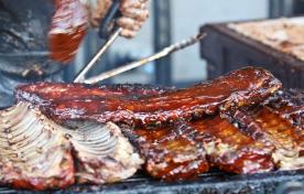 Sauced ribs on an outdoor bbq