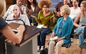 Group of people attending a community meeting
