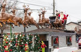 Santa Claus parade, Santa on a parade float in a sleigh with reindeer