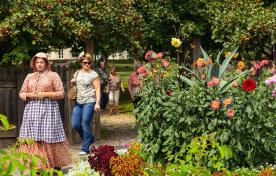 Group of people being led on a tour of gardens at Dundurn National Historic Site