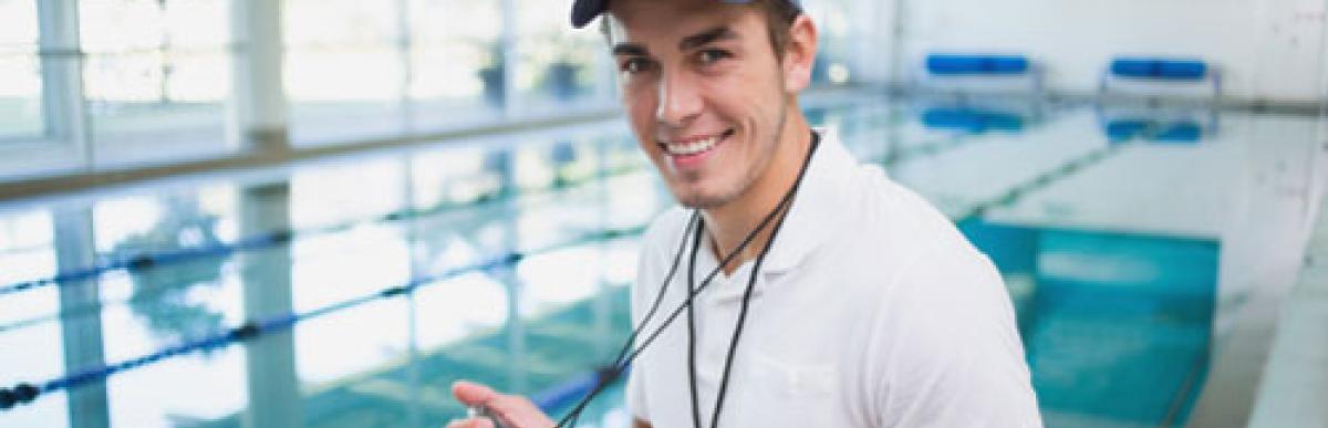 Dude with stopwatch at pool