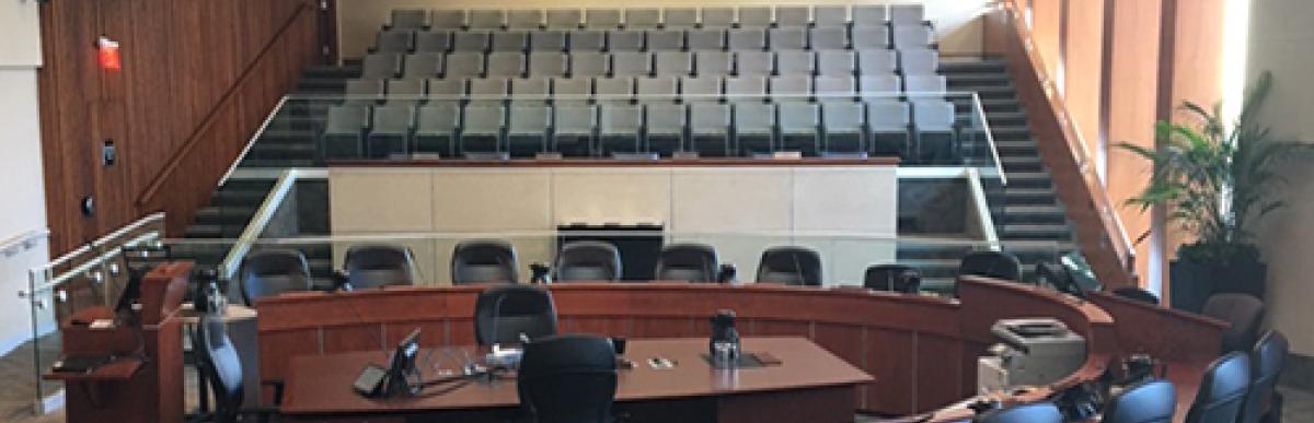 City Hall Council Chambers, circle of chairs and speakers podium