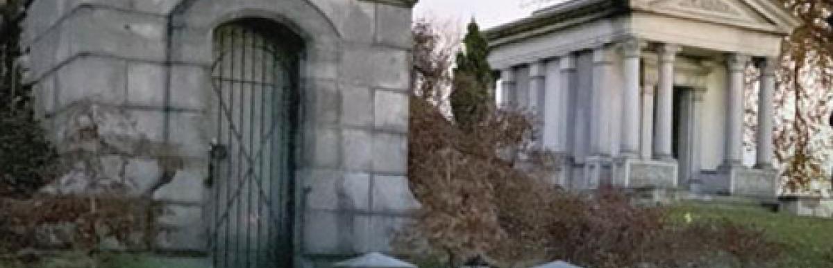 Stone crypt on grassy hill