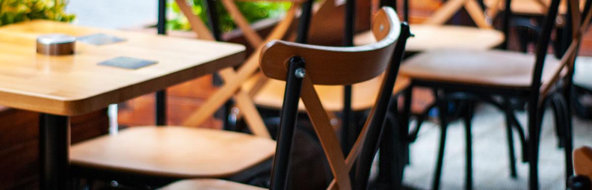 Outdoor table and chairs on restaurant's enclosed patio