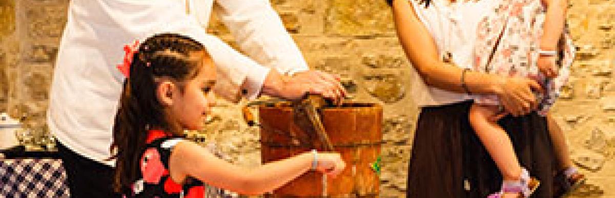 Family celebrating birthday at Museum doing chores