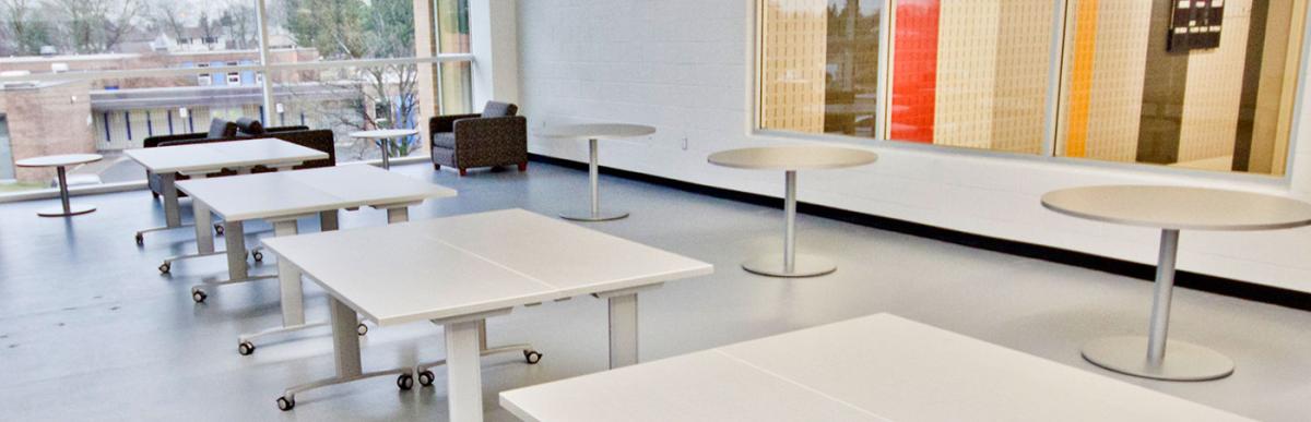 Westmount community room rental, empty space with tables and chairs