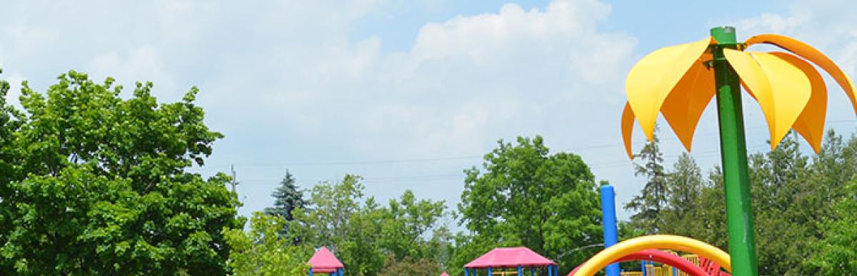 Spray pad and play structures with swings at Memorial Park