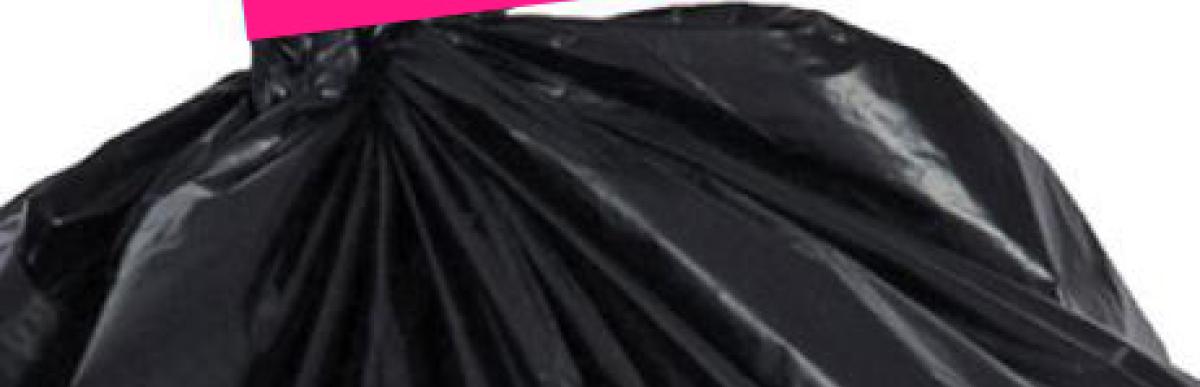 photo of trash bag with pink trash tag
