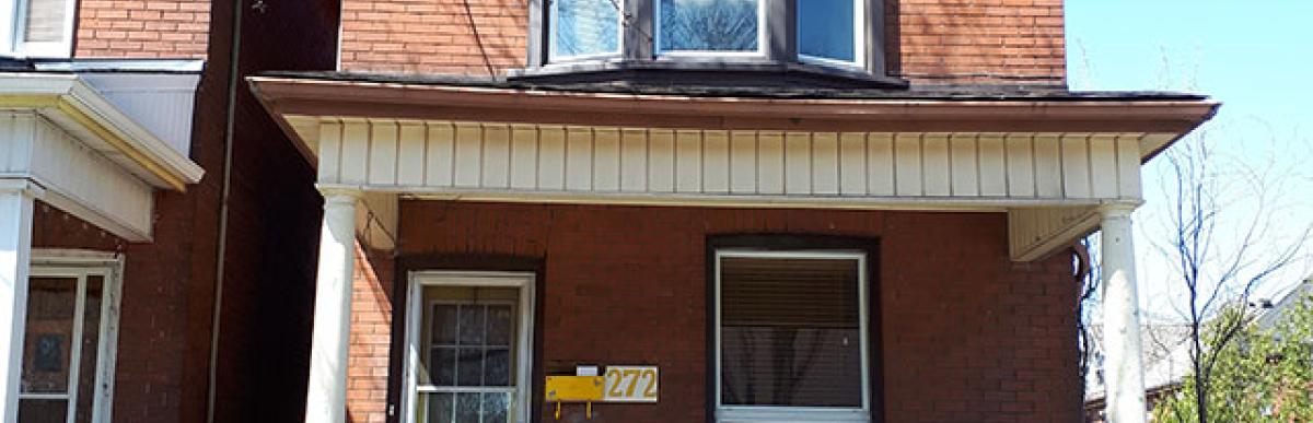 Street view of 2 storey red brick house on 272 Sherman Avenue South, Hamilton