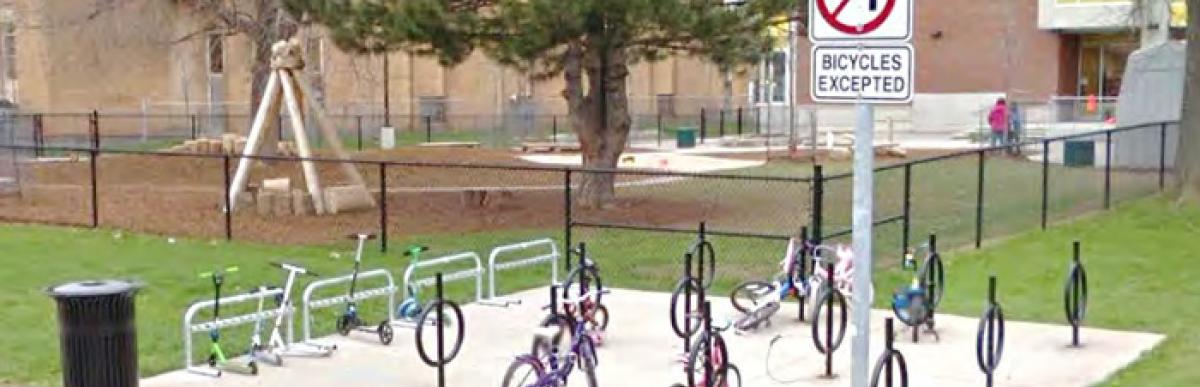 bikes locked at racks in front of school