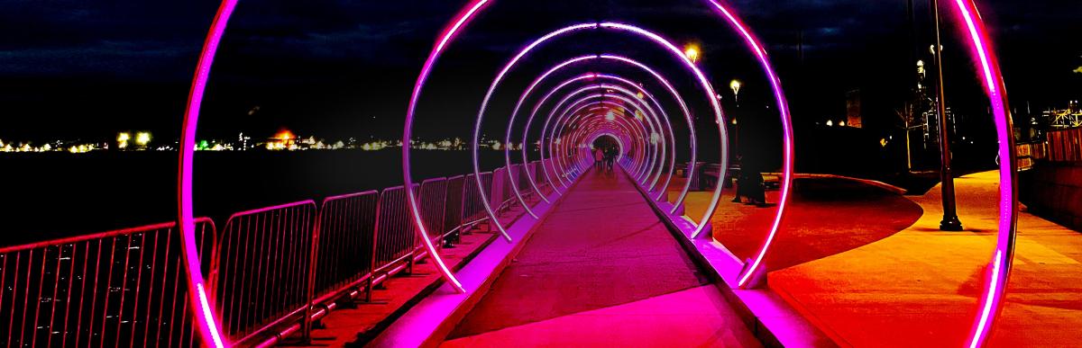 Pink neon arches of Sonic Runway art installation at Pier 8