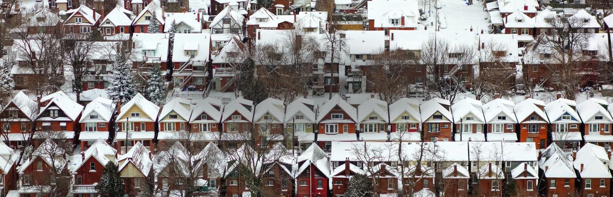 Snow covered homes in central Hamilton
