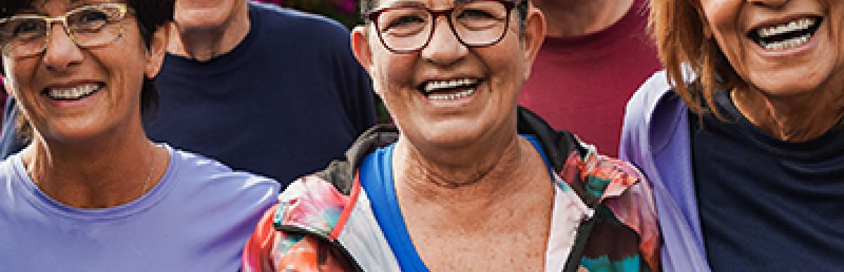 Five seniors in work out clothing, smiling at the camera